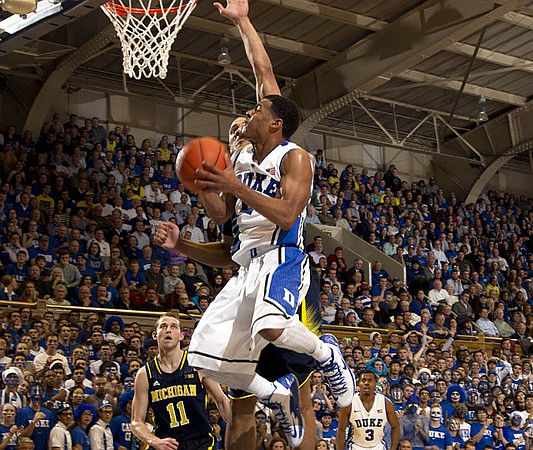 Nik Stauskas (11) and Mitch McGary (4)