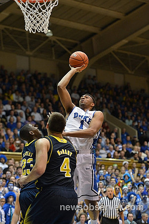 Caris LeVert (23) and Mitch McGary (4)