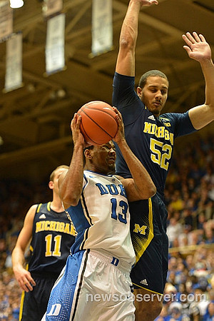 Nik Stauskas (11) and Jordan Morgan (52)