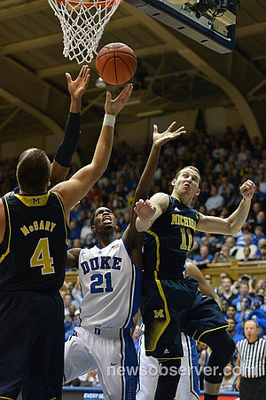 Mitch McGary (4) and Nik Stauskas (11)