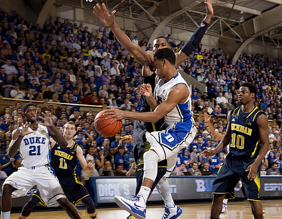 Nik Stauskas (11) and Derrick Walton Jr. (10)