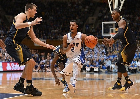 Mitch McGary (4), Caris LeVert (23), and Glenn Robinson III (1)