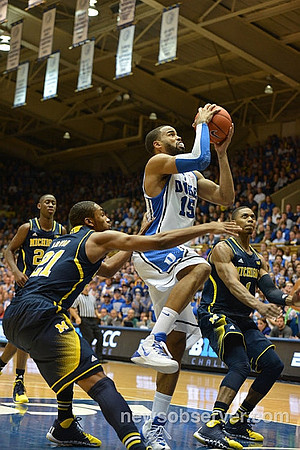 Caris LeVert (23), Zak Irvin (21), and Glenn Robinson III (1)