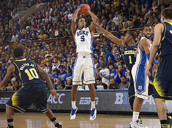 Derrick Walton Jr. (10), Glenn Robinson III (1), and Mitch McGary (4)