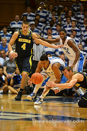 Mitch McGary (4) and Nik Stauskas (11)
