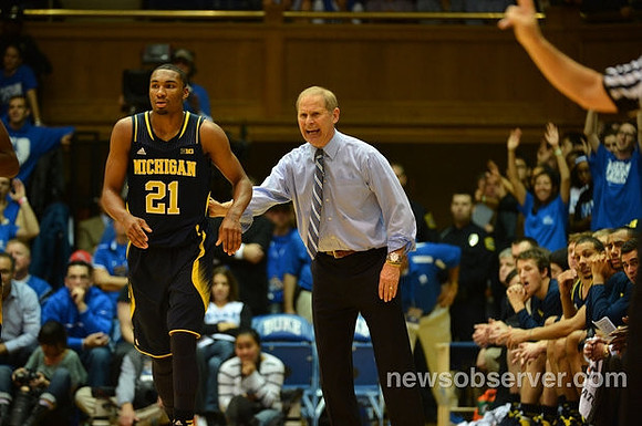 Zak Irvin (21) and John Beilein
