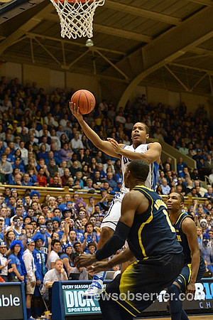 Glenn Robinson III (1) and Zak Irvin (21)