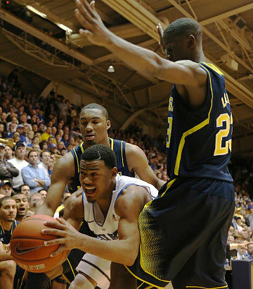 Zak Irvin (21) and Caris LeVert (23)