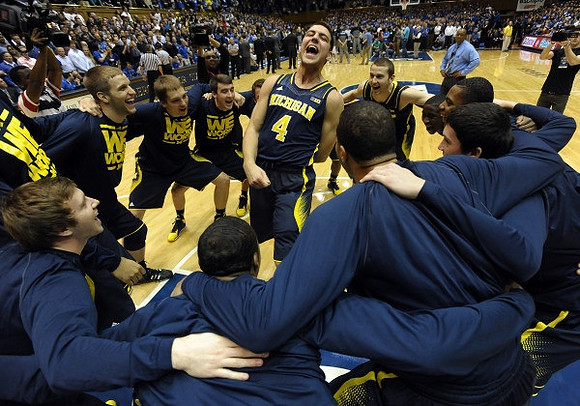 Derrick Walton Jr. (10) and Caris LeVert (23)