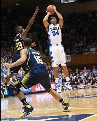 Caris LeVert (23) and Jon Horford (15)