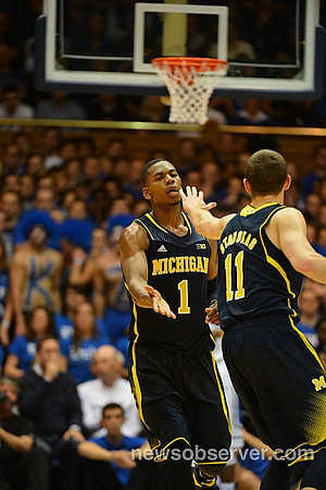 Glenn Robinson III (1) and Nik Stauskas (11)