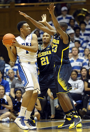 Nik Stauskas (11) and Derrick Walton Jr. (10)