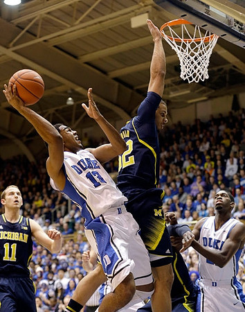 Nik Stauskas (11) and Jordan Morgan (52)