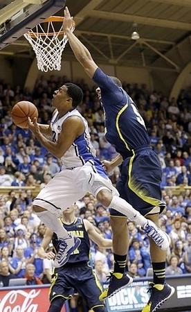 Nik Stauskas (11) and Jordan Morgan (52)