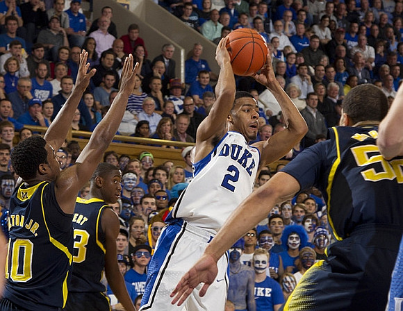 Derrick Walton Jr. (10), Caris LeVert (23), and Jordan Morgan (52)