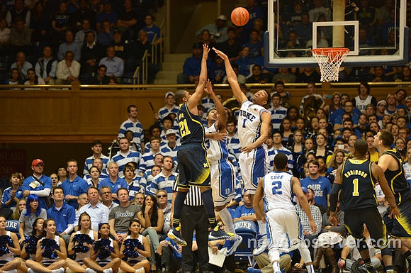 Zak Irvin (21), Glenn Robinson III (1), and Mitch McGary (4)