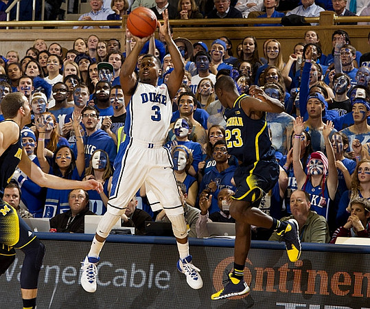Nik Stauskas (11) and Caris LeVert (23)