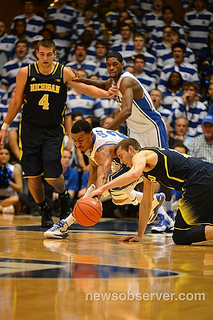 Mitch McGary (4) and Nik Stauskas (11)
