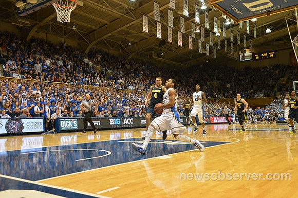 Mitch McGary (4), Nik Stauskas (11), and Derrick Walton Jr. (10)