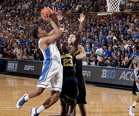 Caris LeVert (23) and Mitch McGary (4)