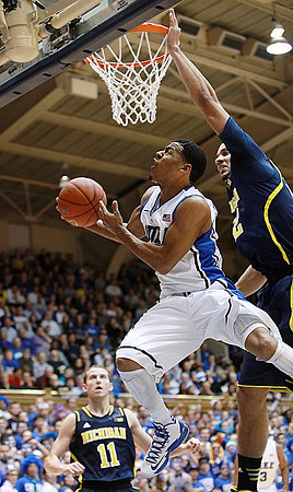 Nik Stauskas (11) and Jordan Morgan (52)