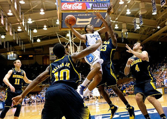 Nik Stauskas (11), Derrick Walton Jr. (10), Caris LeVert (23), and Mitch McGary (4)