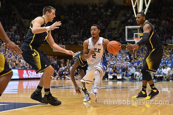 Mitch McGary (4), Caris LeVert (23), and Glenn Robinson III (1)