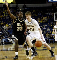 Evan Smotrycz (23) and Zack Novak (0)