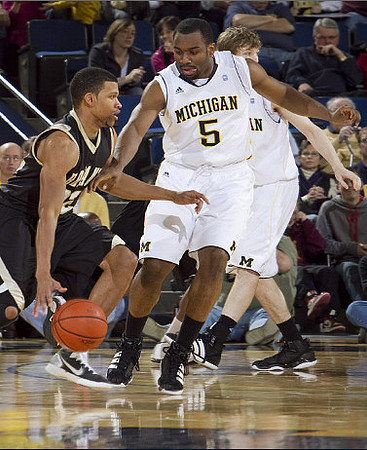 Eso Akunne (5) and Matt Vogrich (13)