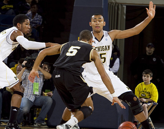 Darius Morris (4) and Jon Horford (15)