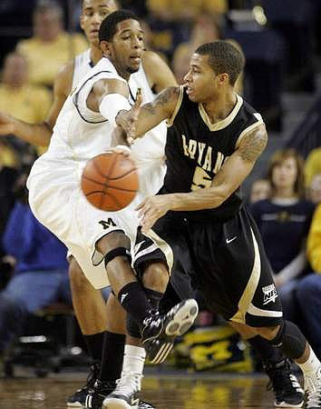 Darius Morris (4) and Jon Horford (15)
