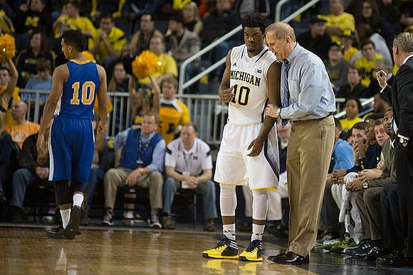 Derrick Walton Jr. (10) and John Beilein