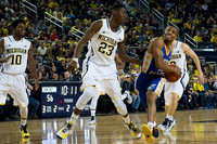 Derrick Walton Jr. (10), Caris LeVert (23), and Spike Albrecht (2)