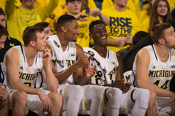 Spike Albrecht (2), Zak Irvin (21), Caris LeVert (23), and Max Bielfeldt (44)