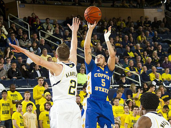 Spike Albrecht (2) and Derrick Walton Jr. (10)