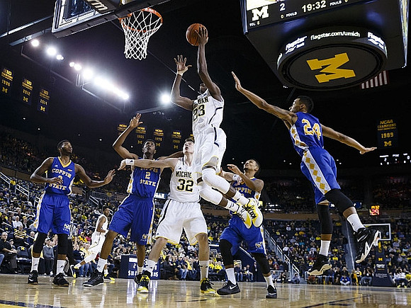 Ricky Doyle (32) and Caris LeVert (23)