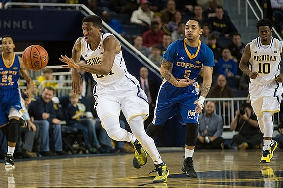 Aubrey Dawkins (24) and Derrick Walton Jr. (10)