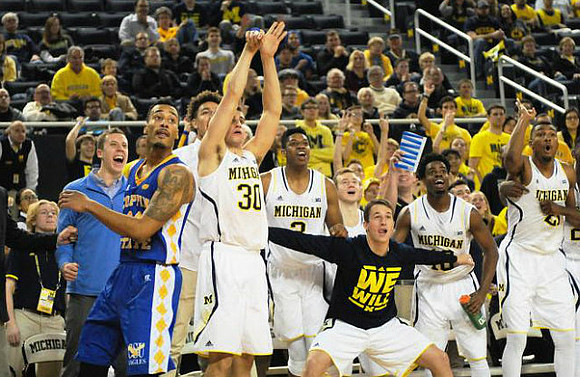 Austin Hatch (30) and Michigan Team