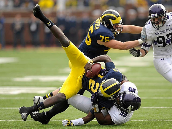 Michael Schofield (75) and Devin Gardner (12)