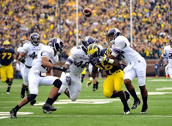 Fitzgerald Toussaint (28) and Taylor Lewan (77)