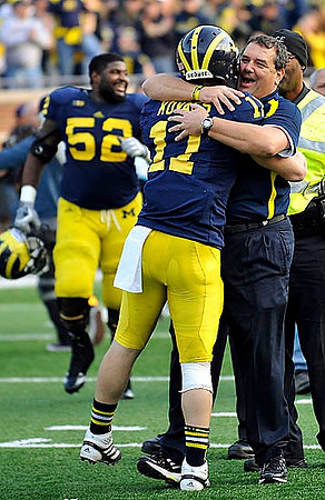 Ricky Barnum (52), Jordan Kovacs (11), and Brady Hoke