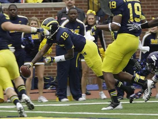 Drew Dileo (9), Devin Gardner (12), and Devin Funchess (19)