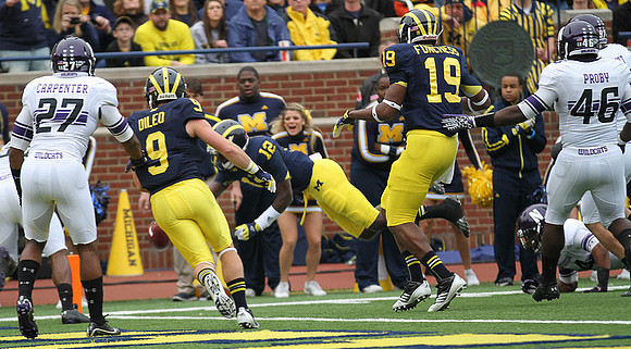 Drew Dileo (9), Devin Gardner (12), and Devin Funchess (19)