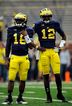 Denard Robinson (16) and Devin Gardner (12)