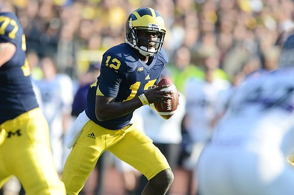 Taylor Lewan (77) and Devin Gardner (12)