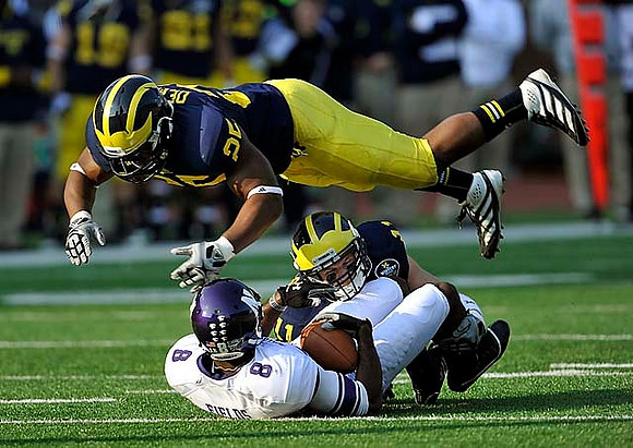Kenny Demens (25) and Jordan Kovacs (11)
