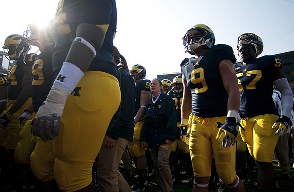 Drew Dileo (9) and Frank Clark (57)