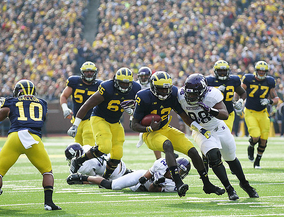 Jeremy Gallon (10), Elliott Mealer (57), Patrick Omameh (65), Devin Gardner (12), Ricky Barnum (52), and Taylor Lewan (77)