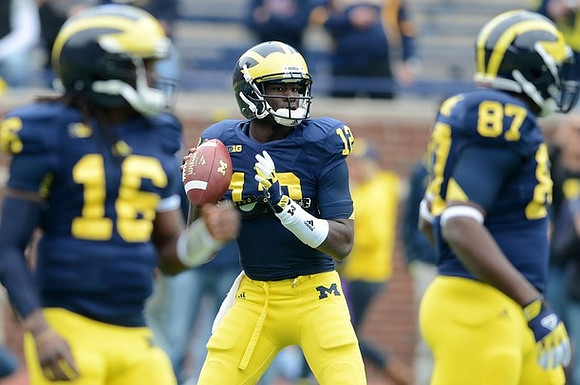 Denard Robinson (16), Devin Gardner (12), and Brandon Moore (87)