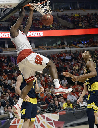 Mark Donnal (34), Spike Albrecht (2), and Zak Irvin (21)